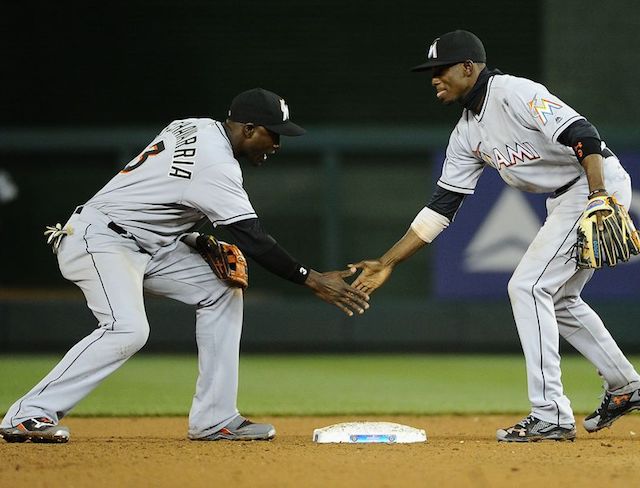 Marlins coach Perry Hill works positioning and basics with infield